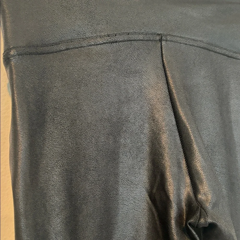 Spanx Women’s Black Faux Leather Leggings in a size Small.